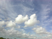 image of cirrus clouds over cumulus clouds