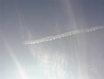 image of cirrostratus clouds over contrail